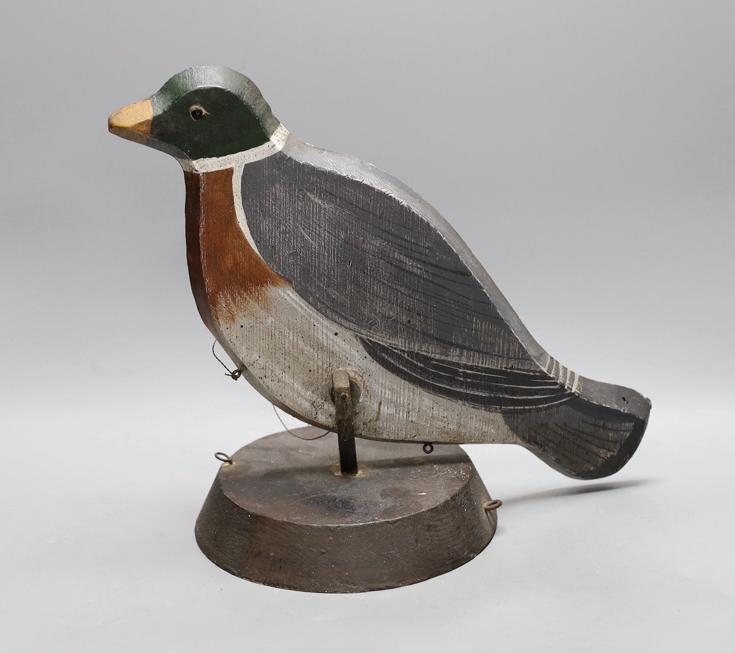 A painted wood pecking decoy bird, 31 cms high